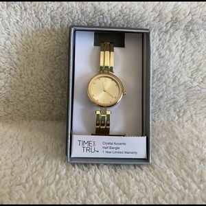 Gold bangle watch